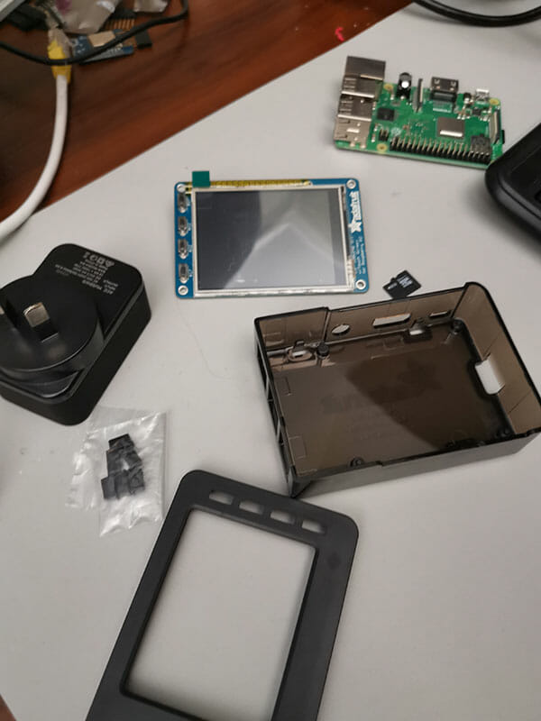 Photo of a Raspberry Pi 3B+, LCD screen and case
